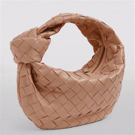nude designer handbag