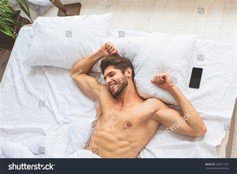 nude guy in bed