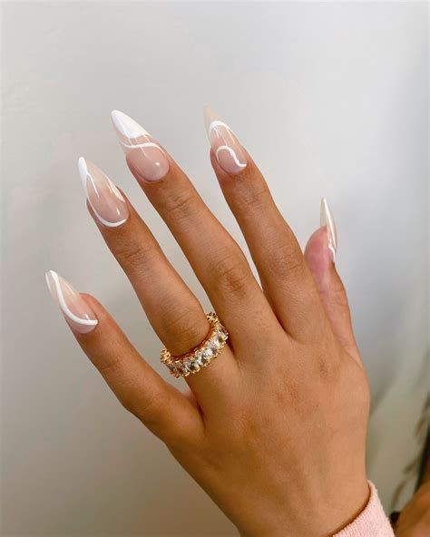 nude nails with white design