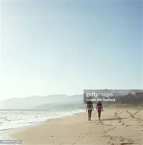 nudes walking on beach