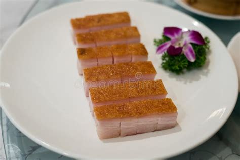 premium Chinese crispy roasted belly pork in White dishes at