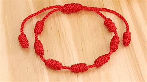 Pulsera De Los 7 Nudos Roja