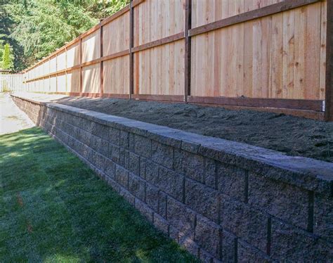 retaining wall next to fence
