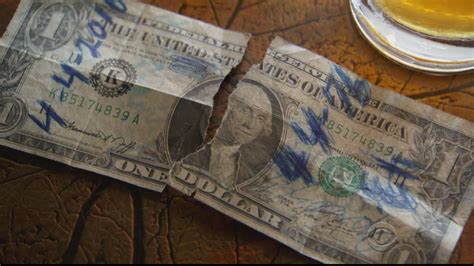 ripped dollar bill