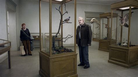 roy andersson pigeon on a branch
