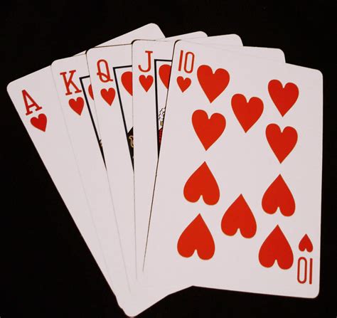 Royal Flush Straight Flush Of Hearts Cards In Poker Game Against Black Background Stock Photo - Kingbet