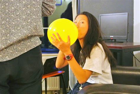 Student Blowing Up A Balloon As Part Of Balloon Blow Up Science Experiment - Balloon Blow Up Science Experiment