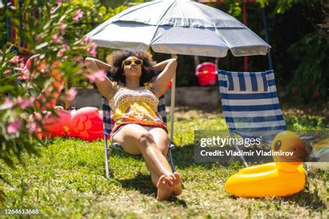 sunbathing nude in the backyard