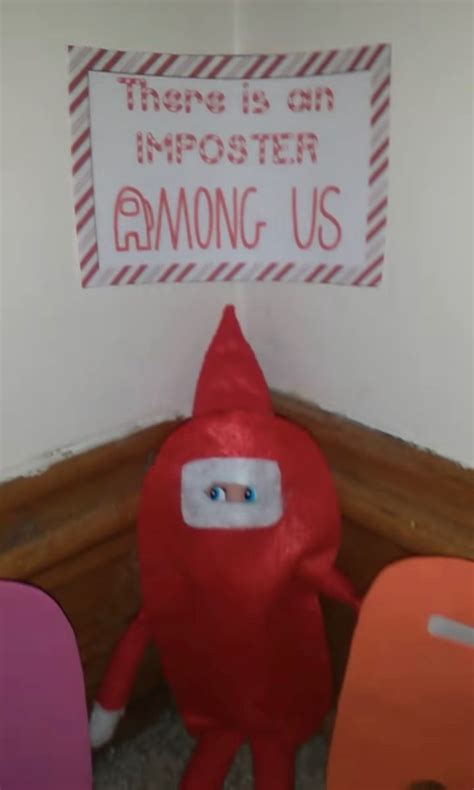 there is an inflatable red object sitting on the floor next to some chairs