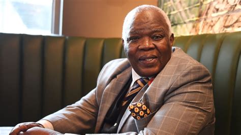 wallace mgoqi biography