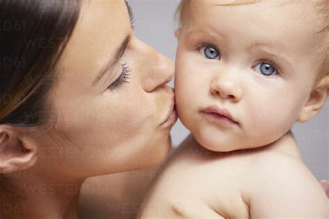 when can mom kiss baby on lips