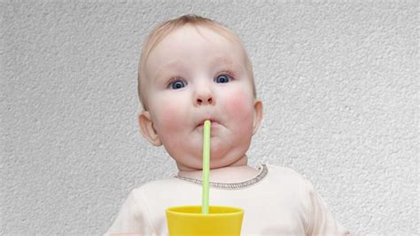when do babies learn to drink from a straw