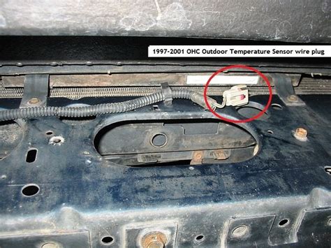 where is exterior temperature thermometer found 2010 jeep liberty?