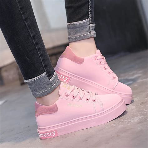white and pink designer shoes