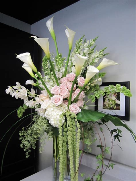 White Flowers In Tall Vase