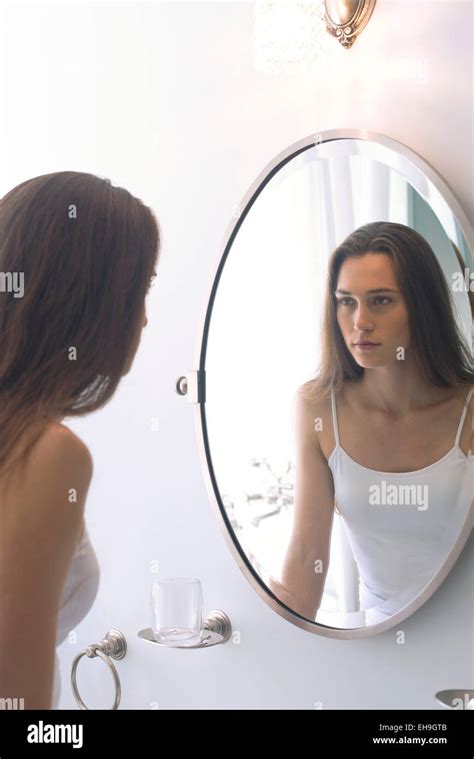 Woman In Bathroom Mirror