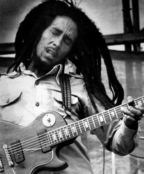 Young Bob Marley Playing Guitar